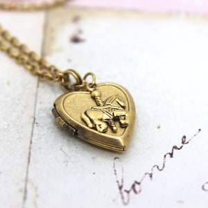 carousel horse. locket necklace. in gold ox jewelry