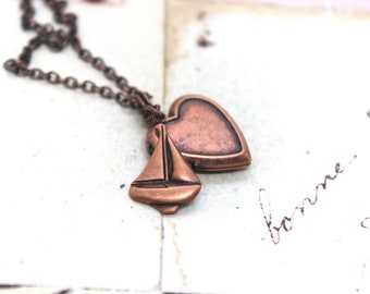 boat. heart locket necklace. copper ox