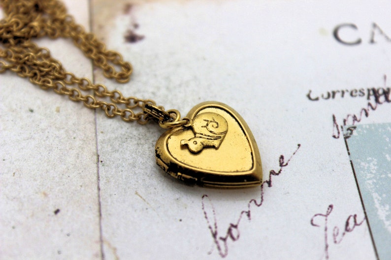 gold ox jewelry snail heart locket necklace
