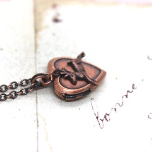 deer heart locket necklace. copper ox
