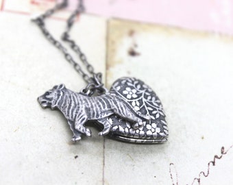 tiger. heart locket necklace. in silver ox with floral pattern
