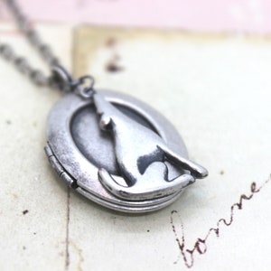 coyote oval. locket necklace. silver ox