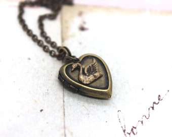 swan. locket necklace. brass ox jewelry