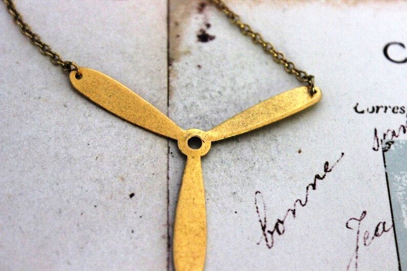 propeller. necklace. gold ox jewelry image 2