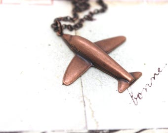airplane necklace. copper ox in flight