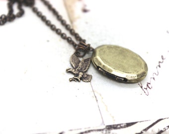 eagle. locket necklace. in brass ox