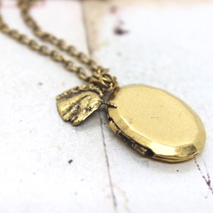 unicorn. heart locket necklace. in gold ox