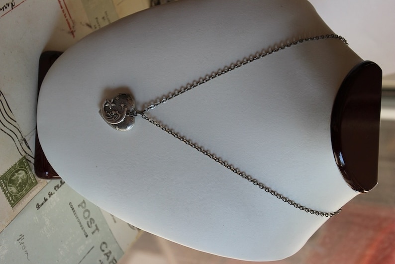 in silver ox jewelry heart locket necklace moon and stars