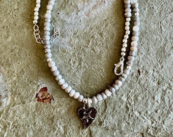 Hand forged sterling silver heart charm on a faceted moonstone necklace