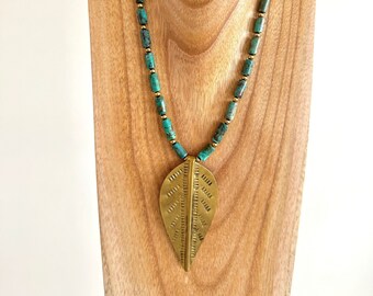 Hand forged brass leaf pendant on a genuine turquoise necklace