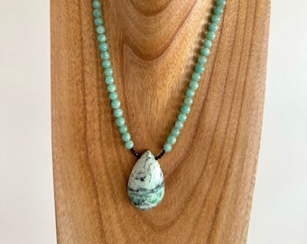 Extraordinary green stone pendant on an amazonite necklace