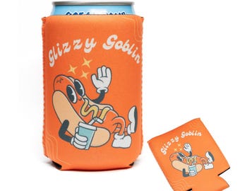 May include: Orange can cooler featuring a cartoon hot dog character and the text "Glizzy Goblin." The hot dog is holding a drink. A matching flat cooler is also visible.