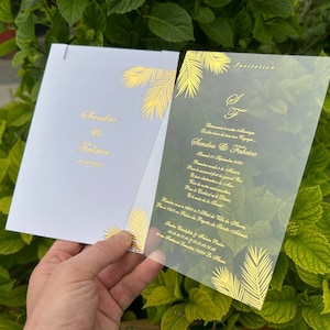 White clear acrylic invitation set with gold print and floral design