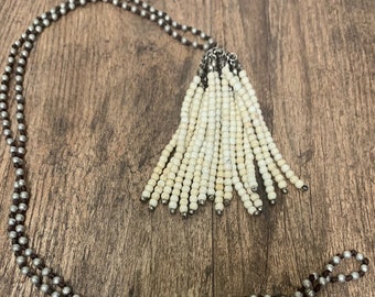 brown tassel necklace on silver strung beads. Similar seen in Brighton