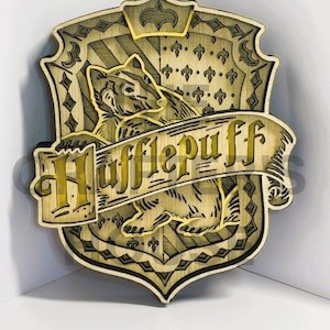 May include: Wooden Hufflepuff house crest with a badger illustration and the word "Hufflepuff" on a banner. The crest is in shades of brown and gold, with intricate details and a layered design. The background is white.