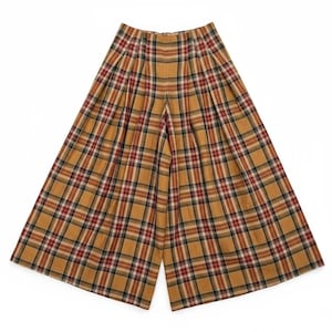 May include: Wide-leg plaid pants in a warm color palette of gold, red, black, and white. The pants feature a classic plaid pattern and a pleated front. The fabric appears to be a medium-weight material, suitable for various seasons.