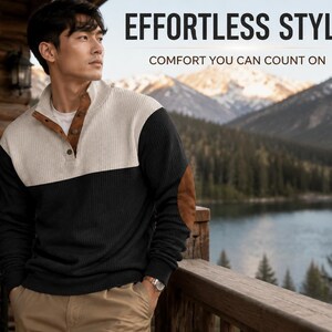 Puede incluir: Un suéter de bloques de color con cremallera corta, parte superior color crema y parte inferior negra, acentuado con parches de ante marrón en los codos y una tapeta de botones marrón. El texto dice EFFORTLESS STYLE COMFORT YOU CAN COUNT ON.