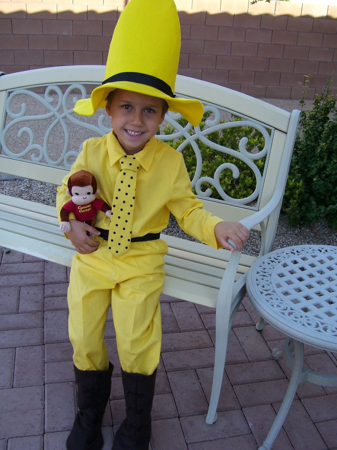 Man with the yellow hat costume