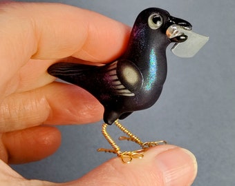 Attempted Murder Iridescent Raven Crow  carrying a knife miniature polymer clay bird sculpture OOAK