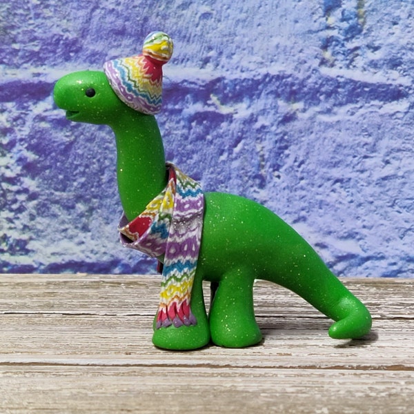 Bright green dinosaur in a rainbow scarf and beanie miniature brontosaurus cute kawaii figurine OOAK