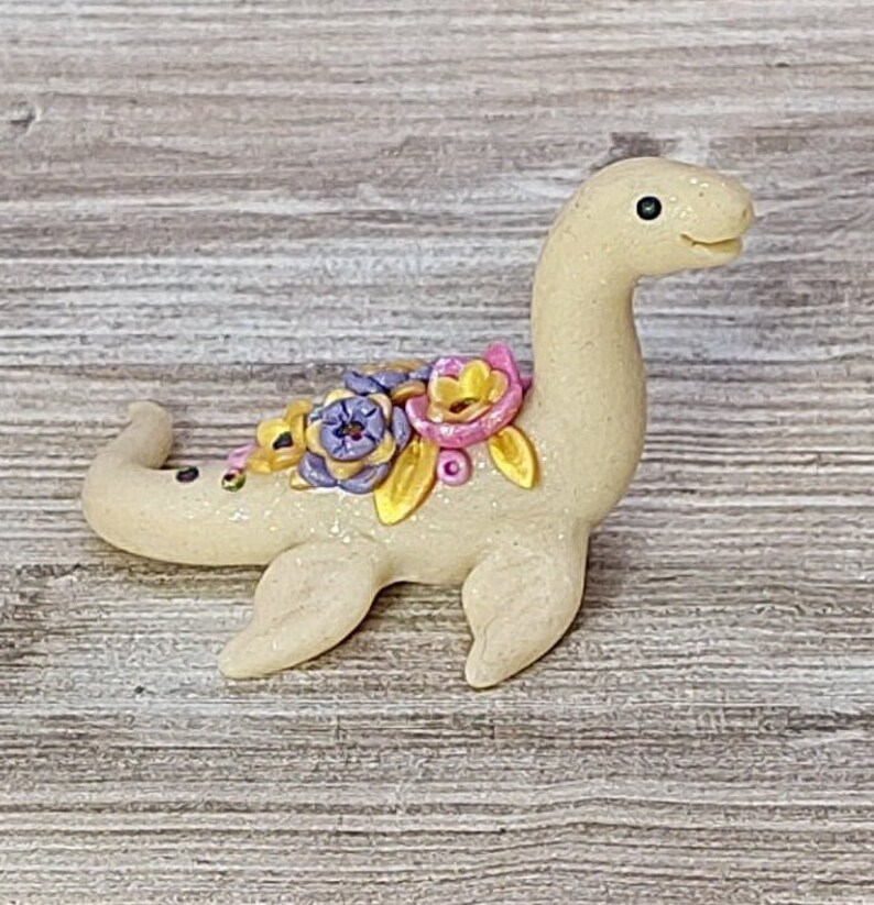 Ivory colored miniature pastel floral Nessie lake monster dinosaur figurine image 1