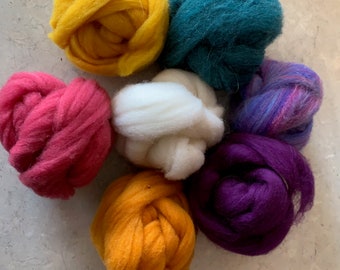 May include: Six balls of wool yarn in various colors, including yellow, orange, pink, white, purple, and teal.