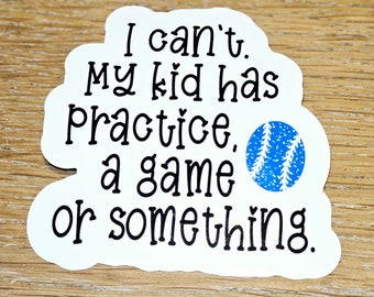 May include: White sticker with black text that reads "I can't. My kid has Practice, a game or something." A blue baseball graphic is on the right side. The sticker is on a wooden surface.
