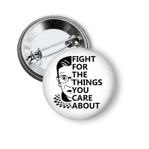 May include: White button with a black and white image of Ruth Bader Ginsburg and the text "Fight for the things you care about."