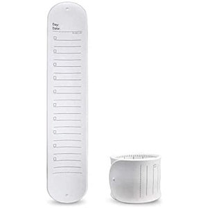 May include: A white, elongated to-do list with a series of boxes and lines, accompanied by a cylindrical container. The list has the words "Day:" and "Date:" at the top. The items are designed for organization and planning.