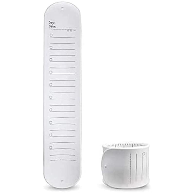 May include: A white, elongated to-do list with a series of boxes and lines, accompanied by a cylindrical container. The list has the words "Day:" and "Date:" at the top. The items are designed for organization and planning.