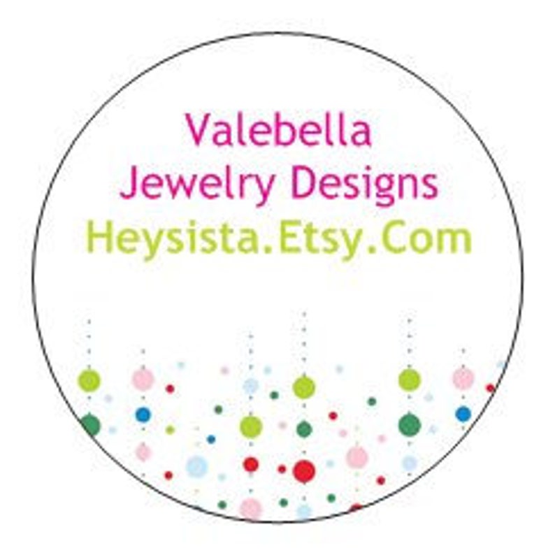 May include: A white circle with the text "Valebella Jewelry Designs Heysista.Etsy.Com" in pink and green. The bottom of the circle is decorated with a row of colorful dots.