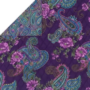 May include: A reversible textile with a paisley and floral pattern. One side features a deep purple quilted background with large paisley designs in teal, blue, and pink, interspersed with purple flowers. The reverse side has a similar paisley pattern on a teal background.