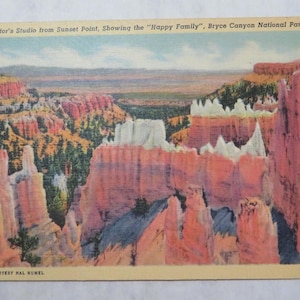 May include: Vintage postcard featuring a scenic view of Bryce Canyon National Park in Utah. The image shows the "Happy Family" rock formations, with text that reads "Sculptor's Studio from Sunset Point". The postcard has a light tan border.