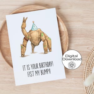 May include: A white greeting card with a cartoon illustration of a robot wearing a party hat. The text reads "IT IS YOUR BIRTHDAY! FIST MY BUMP!!" A digital download sticker is in the corner.