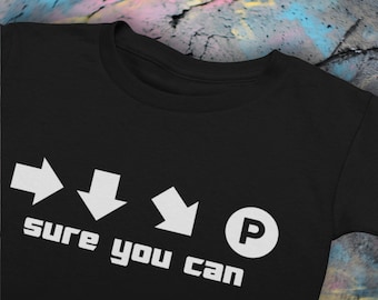 Camiseta negra inspirada en Street Fighter 'Sure You Can' para fanáticos de los juegos de lucha