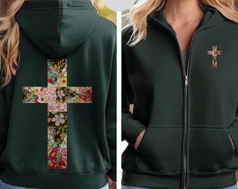 Könnte beinhalten: Waldgrüner Kapuzenpullover mit Reißverschluss und einem floralen Kreuzdesign auf dem Rücken und einem kleineren floralen Kreuz auf der Vorderseite. Der Hoodie hat eine Kapuze, Taschen und einen durchgehenden Reißverschluss. Das florale Kreuz zeigt eine Mischung aus roten, weißen und gelben Blumen.