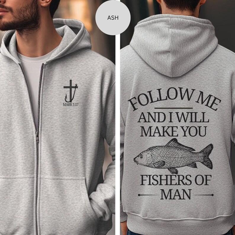 May include: Ash gray zip-up hoodie with a black cross and fish hook design, and the text "MARK 1:17" on the front. The back features the text "FOLLOW ME AND I WILL MAKE YOU FISHERS OF MAN" with a fish illustration.