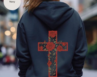 Könnte beinhalten: Marineblauer Kapuzenpullover mit einem roten Kreuzdesign auf dem Rücken, verziert mit roten Rosen und grünen Blättern. Das Wort "Navy" befindet sich in einem Kreis oben links. Der Kapuzenpullover hat eine Kapuze und lange Ärmel.