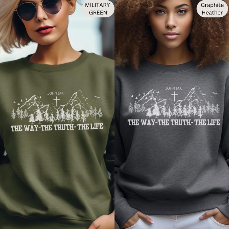 May include: A sweatshirt with a mountain range and cross graphic, the text "JOHN 14:6" and the phrase "THE WAY-THE TRUTH-THE LIFE". The sweatshirt is available in two colors: military green and graphite heather.
