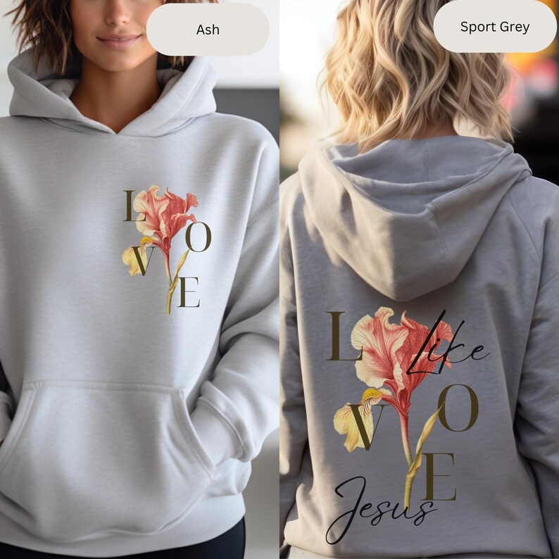 May include: A gray hoodie with a floral design and the text "LOVE like Jesus" printed on the front and back. The hoodie is available in two colors: Ash and Sport Grey.