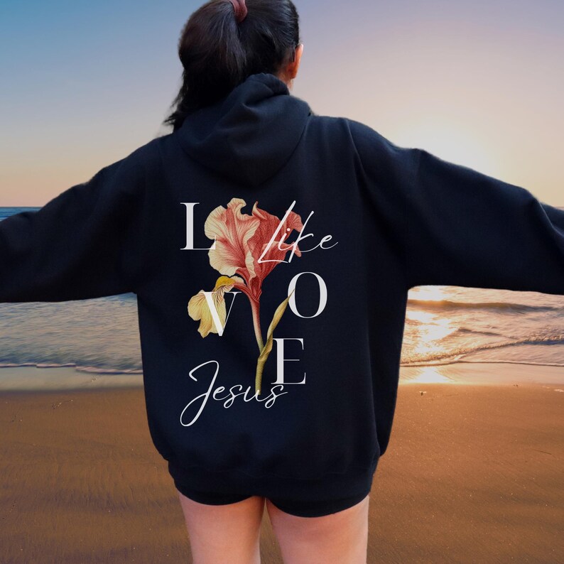 May include: Black hoodie with a floral design and the text "Love like Jesus" printed on the back.