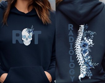 May include: A navy blue hoodie with a skull and flowers design on the front and the word "RADIOLOGY" with a spine and flowers design on the back. The skull has blue eyes and a floral crown. The spine is surrounded by blue flowers.