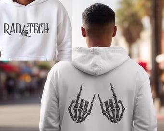 May include: White hoodie with the text "RAD TECH" and a skeleton hand graphic on the front. The back of the hoodie features a graphic of two skeleton hands making a rock and roll hand gesture.