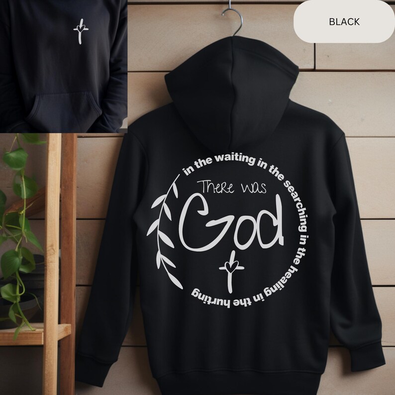 May include: Black hooded sweatshirt with a white graphic design on the back. The graphic features a cross and the text "There was God in the waiting in the searching in the healing in the hurting."
