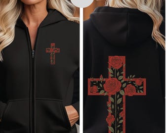 Könnte beinhalten: Schwarzer Kapuzenpullover mit Reißverschluss und rotem Kreuz-Design mit Rosen auf der Vorder- und Rückseite. Der Hoodie hat eine Kapuze, einen Reißverschluss und Taschen. Das Wort "BLACK" ist auf einem weißen Kreis aufgedruckt.