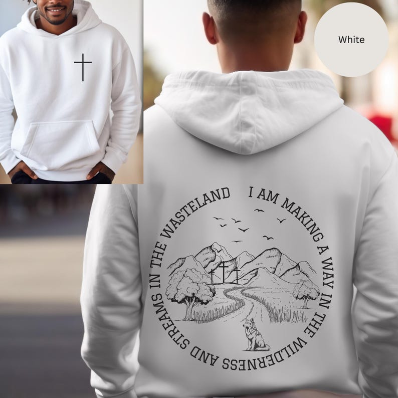 May include: White hooded sweatshirt with a cross on the front and a graphic on the back that says "I am making a way in the wilderness and streams in the wasteland". The graphic features a mountain range, a path, a tree, and a wolf.