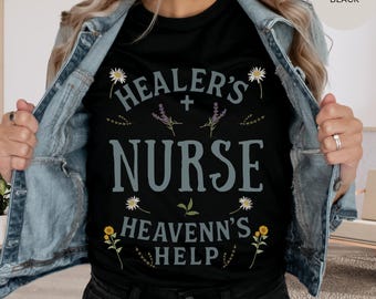 May include: Black t-shirt featuring the text "Healer's Nurse Heavenn's Help" with floral accents. The shirt is paired with a denim jacket and black jeans. The word "Black" is visible in the top right corner.