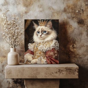 May include: A white and brown cat wearing a gold crown and a red and gold robe sits on a throne. The cat has blue eyes and a serious expression.