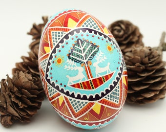 Easter Egg Batik Art: Handmade Pysanky with Two White Deer Under a Tree Design