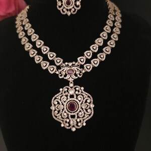 Moissanite stone necklace set with Red centre stone.